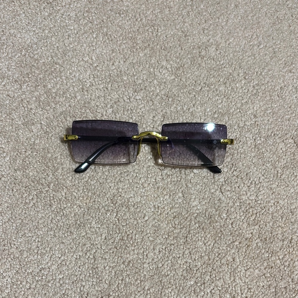 Stylish Purple Sunglasses with Gold Accents